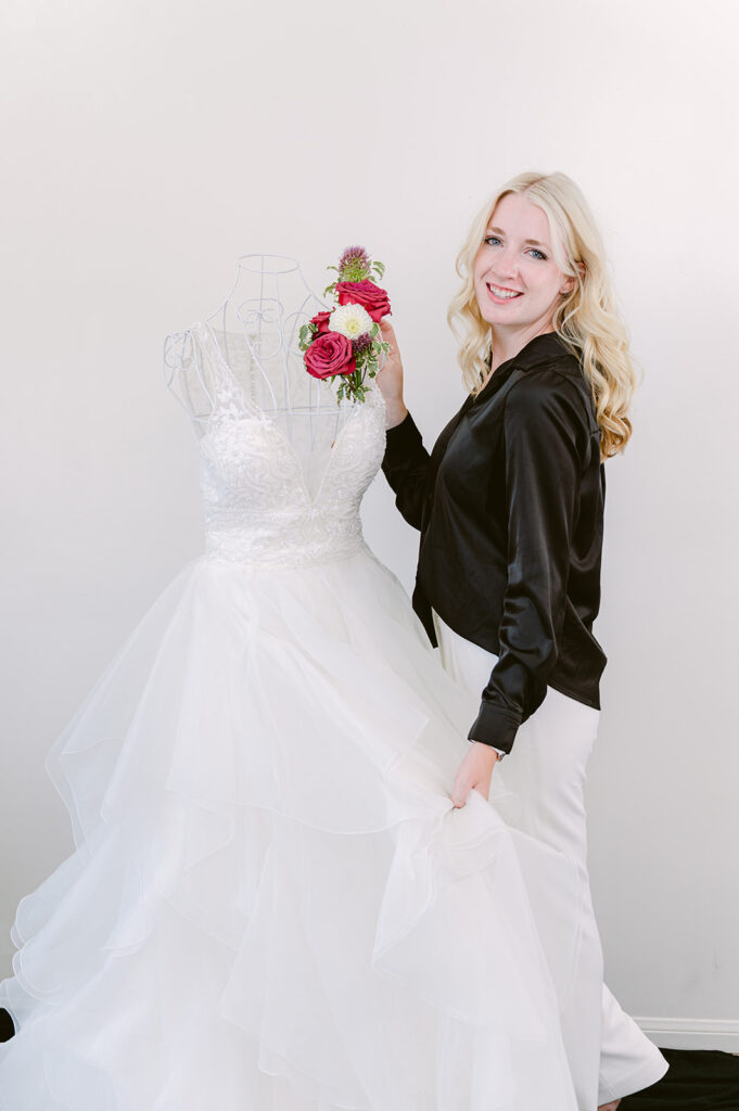 Professional portrait of a wedding planner in a black dress.